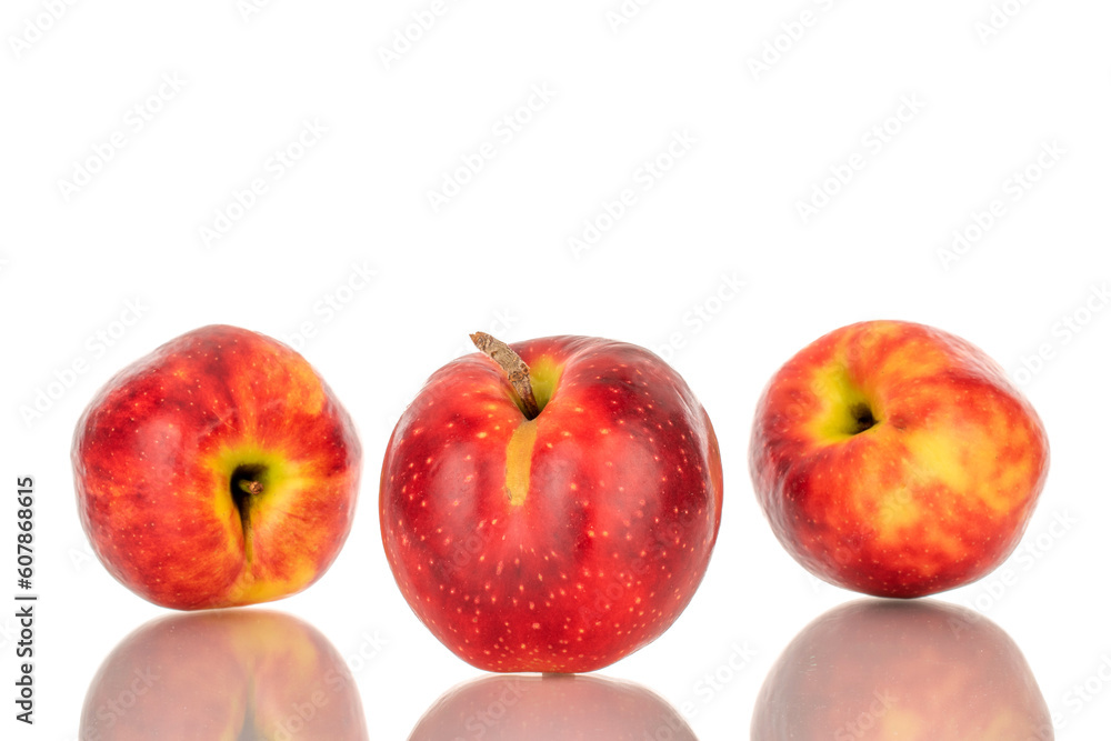 Three red apples, macro, isolated on white background.