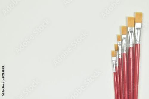 Top view of paint brush on white background with copy space.