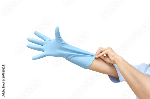 Female shoulder putting on sterile gloves. Hand woman wearing gloves on white background. © aorphoto