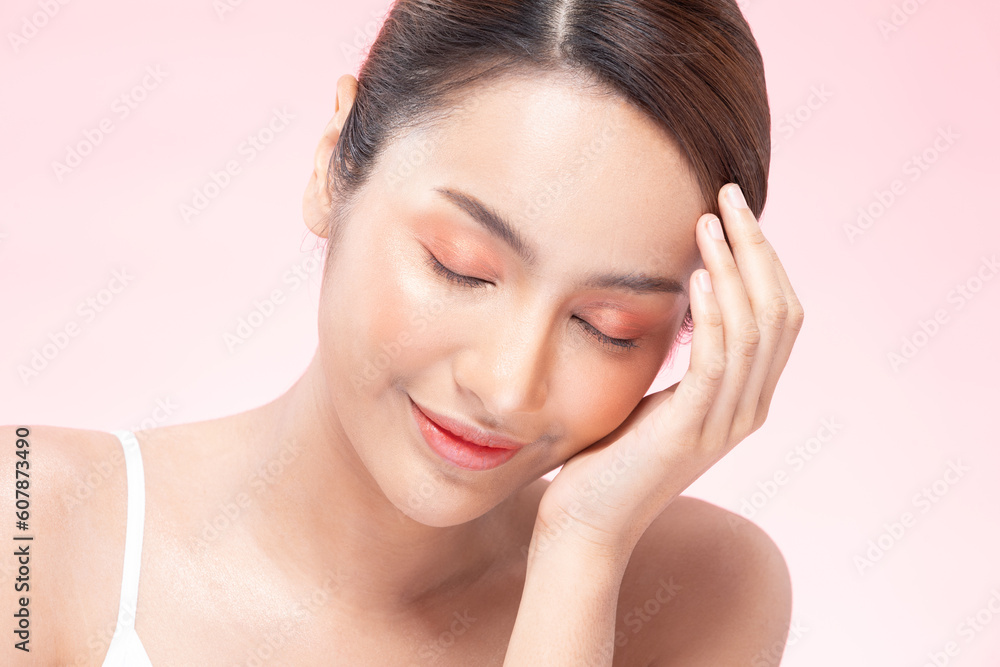 Young Beautiful Asian woman smile touching soft cheek with clean and fresh skin Happiness and cheerful with positive emotional,isolated on pink background,Beauty Cosmetics and spa Treatment Concept Young Beautiful Asian woman smile touching soft cheek with clean and fresh skin Happiness and cheerful with positive emotional,isolated on pink background,Beauty Cosmetics and spa Treatment Concept
