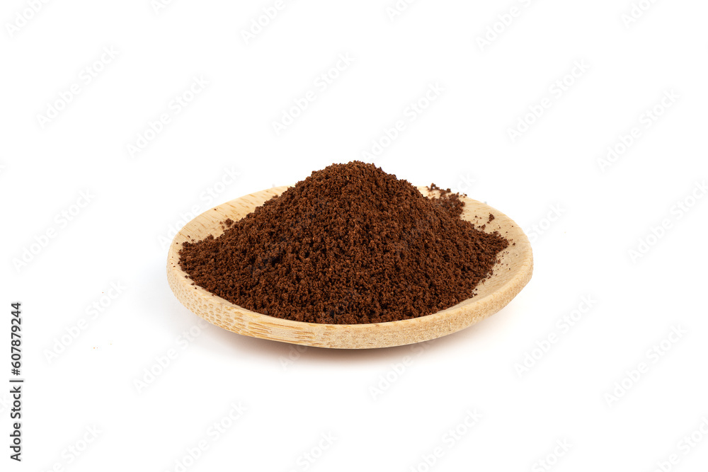 Wooden saucer with ground coffee on a white background. Wooden saucer with ground coffee on a white background.