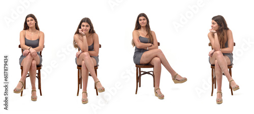Foto front view group of same young girl sitting on chair with cross legged on white