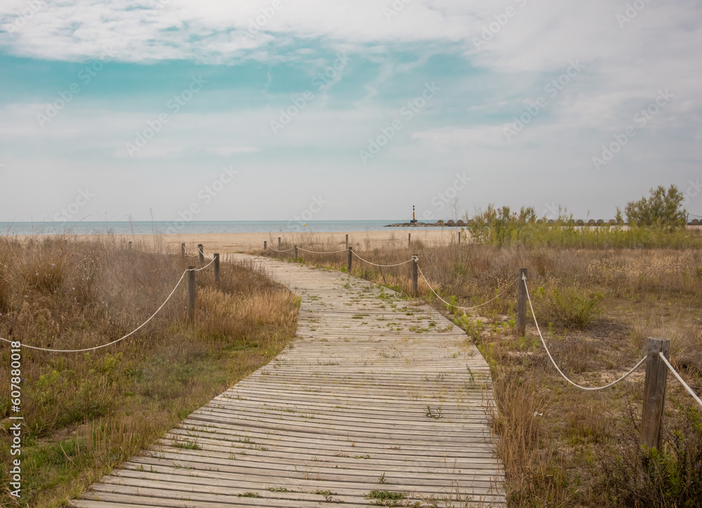 Path through the dunes. Sandy beach with sand dunes. Vacation. Spain