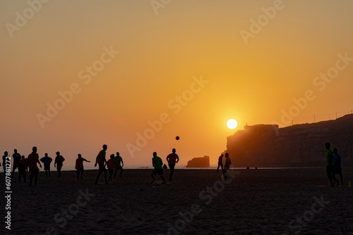 People playing soccer with a view o the sunset in Nazaré Beach © Bruno