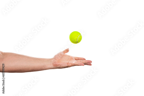 Tennis ball in male hand isolated on a white background. © jul_photolover