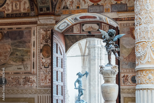 Sculpture of cupid with dolphin in the inside contryyard of a Palazzo Vecchio palace in the old Florence town, Italy.