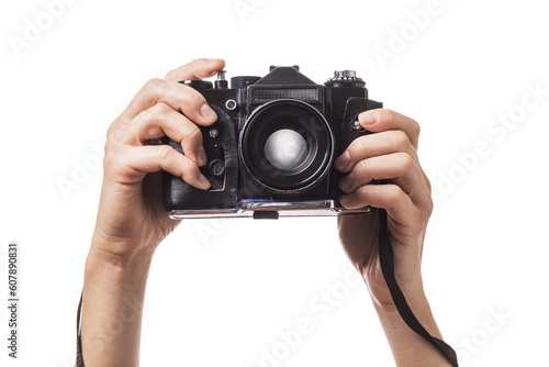Camera in hands isolated on white background