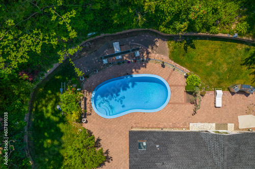 In-ground pool in backyard from an aerial view