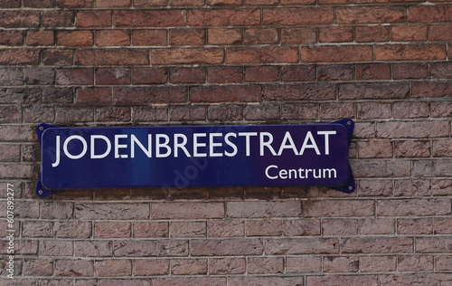 Amsterdam Jodenbreestraat Street Sign on a Brick Wall Close Up, Netherlands.