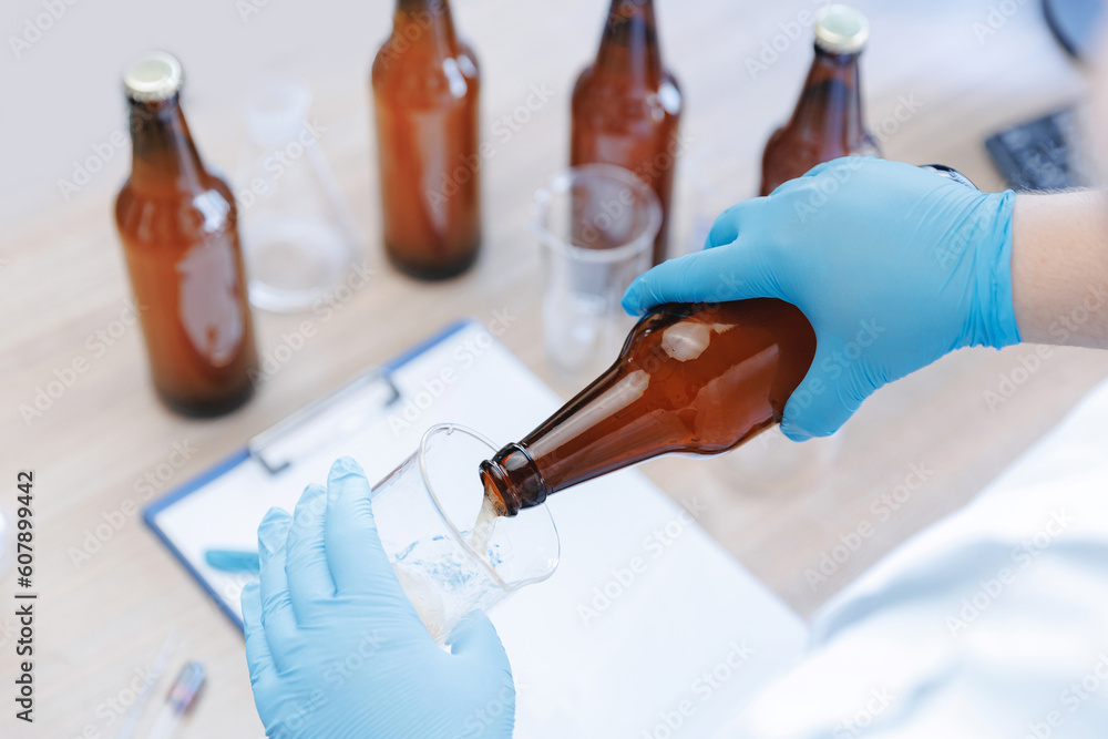 Process test production beer in laboratory, analysis drink in glasses
