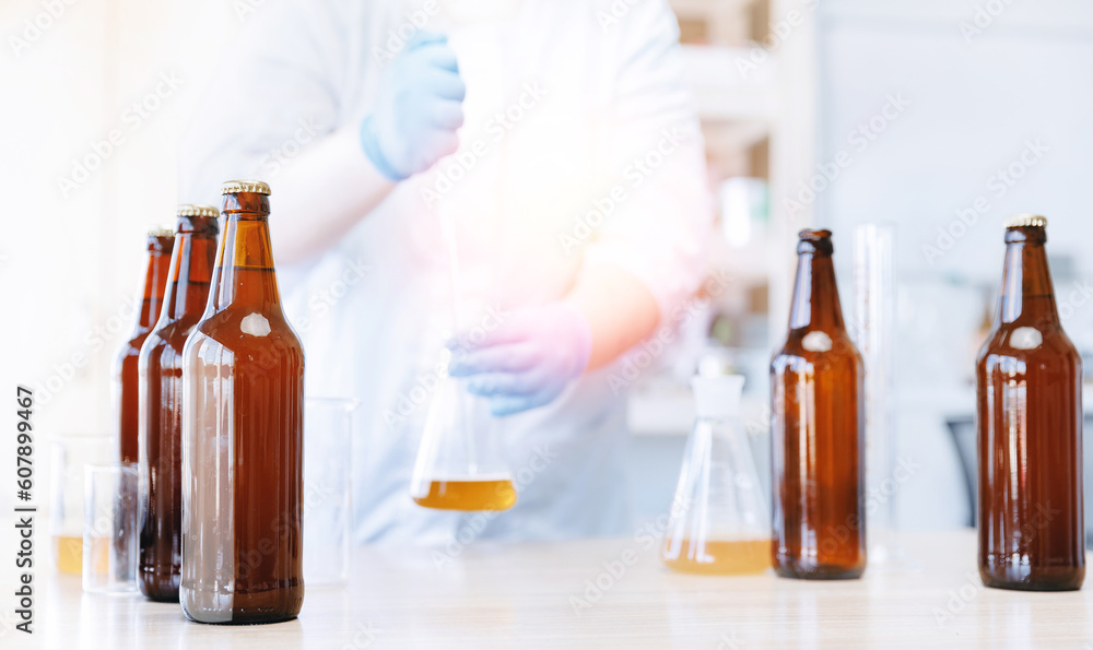 Process test production beer in laboratory, analysis drink in glasses