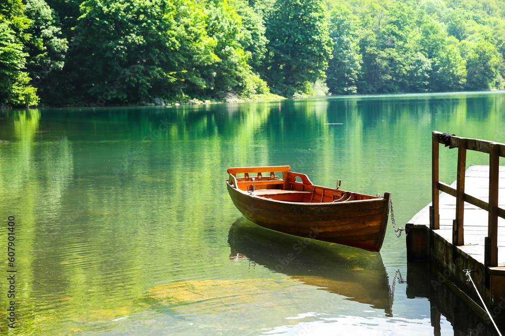 Wooden boat on mountain lake. Biograd lake, Montenegro, Europe