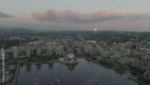 The dome of Science World reflects the setting sun in Vancouver photo
