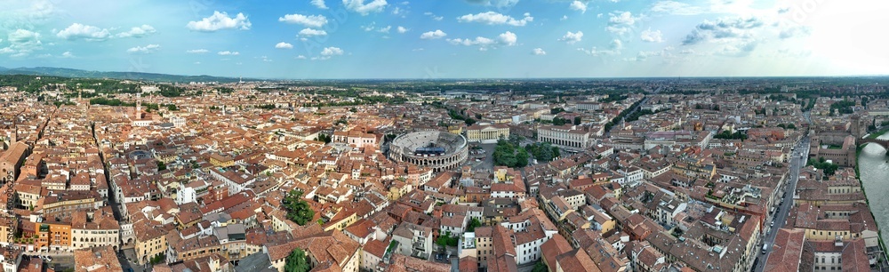 Panoramic aerial view of Verona at sunset with the Verona Arena in the center. Veneto, Italy