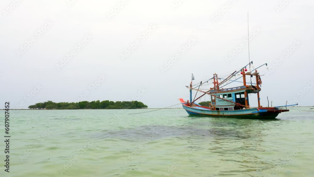 Typical Thai fishing boat on a beautiful clear water island of Koh Samui Typical Thai fishing boat on a beautiful clear water island of Koh Samui