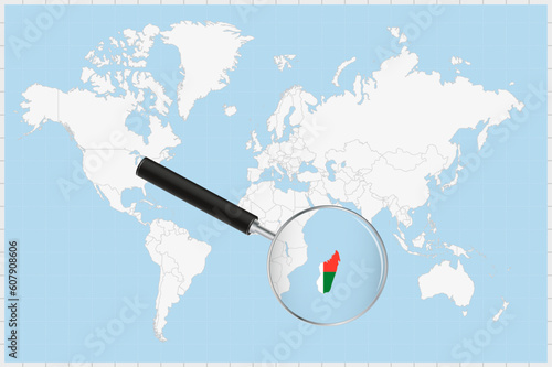 Magnifying glass showing a map of Madagascar on a world map.