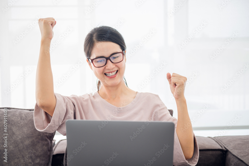 Excited mature female wearing glasses feeling euphoric celebration online win success achievement result, young asian woman happy about good email news, motivated by great offer or new opportunity Excited mature female wearing glasses feeling euphoric celebration online win success achievement result, young asian woman happy about good email news, motivated by great offer or new opportunity