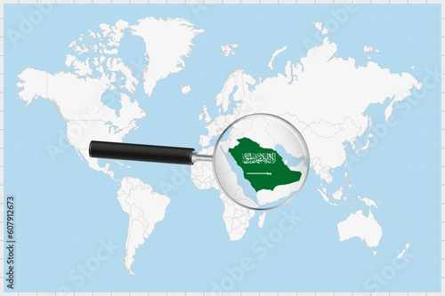 Magnifying glass showing a map of Saudi Arabia on a world map.