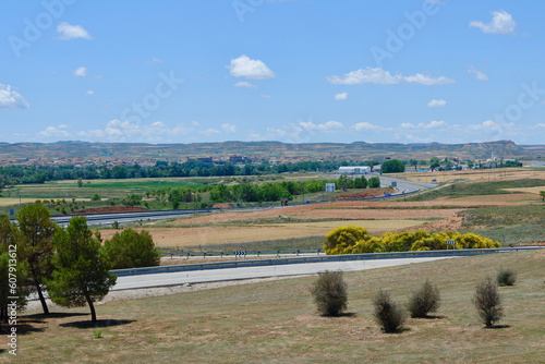 Dry colourful landscape and roadways near the Alama de Aragon, Zaragoza, Spain photo