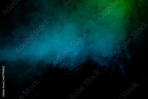 Blue and green steam on a black background. © Nikolay
