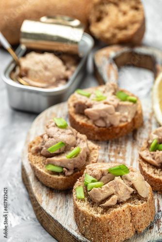 Sandwich with cod liver on rye bread. Healthy food concept. Food recipe background. Close up