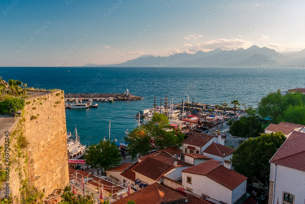 Panorama view from a high point on part of the fortress wall and the old port of Kaleichi in the Turkish city of Antalya. Panoramic view of part of the fortress wall and the old port 