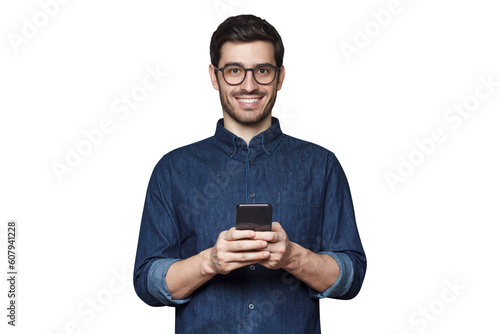 Caucasian male in glasses holding smartphone and looking at camera, isolated