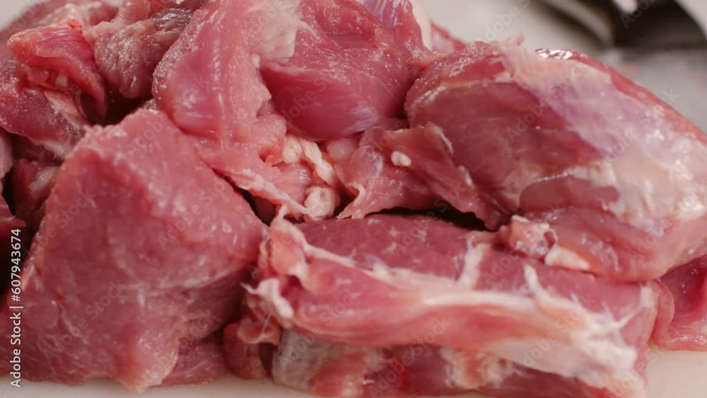 Chef Butcher cutting pork meat with knife on kitchen, cooking Mexican traditional food. Man cut big beef piece for barbecue bbq. Chef Butcher cutting pork meat with knife on kitchen, cooking Mexican traditional food. Man cut big beef piece for barbecue bbq.