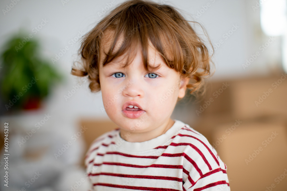 Closeup portrait of adorable little boy looking to camera Closeup portrait of adorable little boy looking to camera