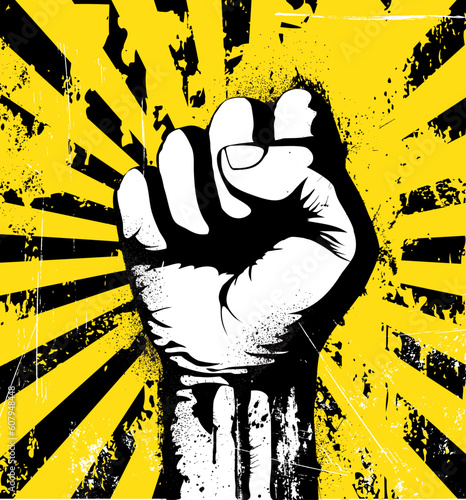 Vector illustration of clenched fist held high in protest on the yellow grunge urban background