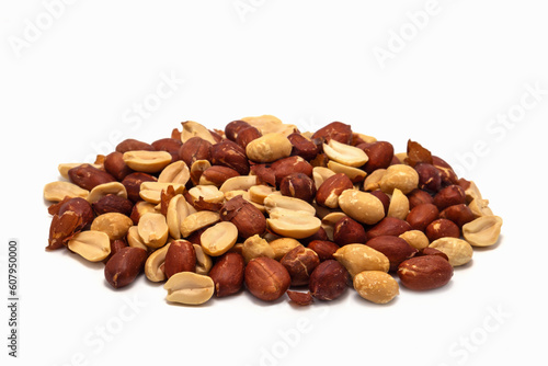 Roasted peanuts in the husk on a white background.