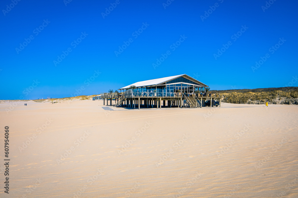 A Cafe in the Foreground of a Sunny Day at the Yellow Sand Beach near The Hague A Cafe in the Foreground of a Sunny Day at the Yellow Sand Beach near The Hague