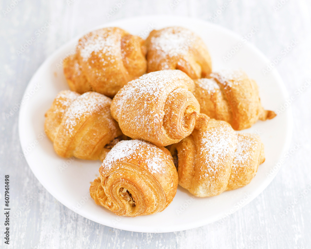 Fresh croissants on white plate Fresh croissants on white plate