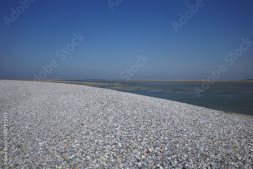 Sea and pebbles on the Baie de Somme, France