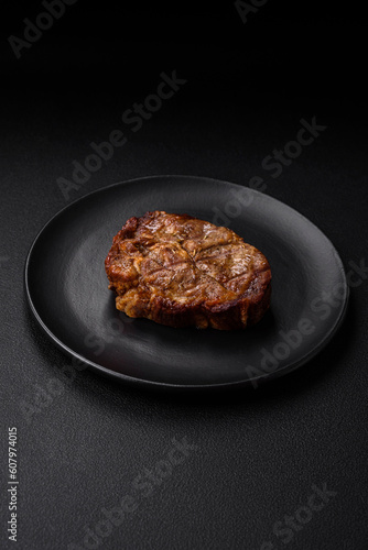 Delicious juicy pork or beef steak grilled with salt, spices and herbs