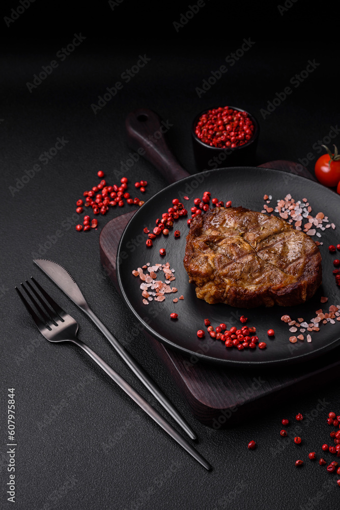 Delicious juicy pork or beef steak grilled with salt, spices and herbs Delicious juicy pork or beef steak grilled with salt, spices and herbs