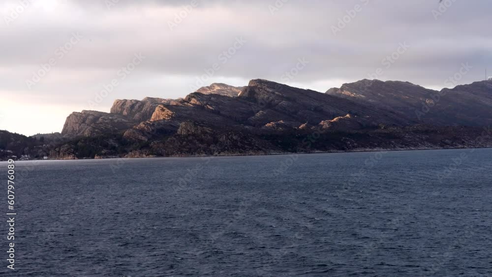 Ferry Boat Cruising At Norwegian Sea , Fiords, Norway. Amazing Summer Scenic View . Ship Or Ferry Boat Liner Floating In Famous Norwegian Natural Landmark And Popular Destination In Summer Day. snowy Ferry Boat Cruising At Norwegian Sea , Fiords, Norway. Amazing Summer Scenic View . Ship Or Ferry Boat Liner Floating In Famous Norwegian Natural Landmark And Popular Destination In Summer Day. snowy