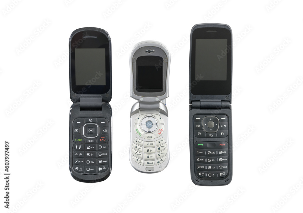 Three old flip cell phones isolated with cut out background. Three old flip cell phones isolated with cut out background.