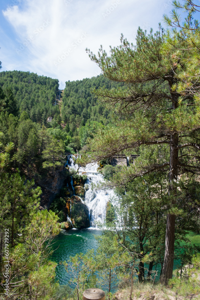 Landscape with pine forest, waterfall and lake. Guadalajara, Spain