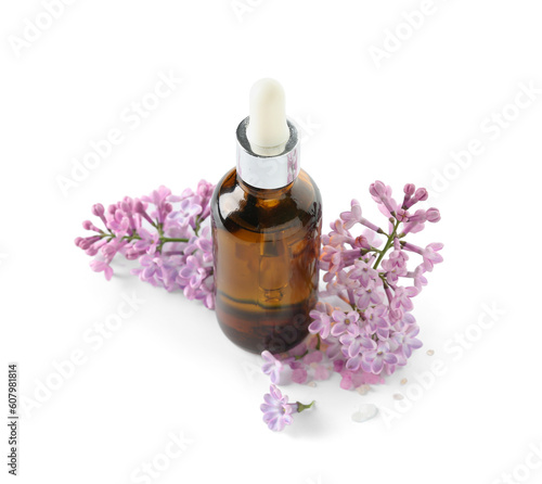 Bottle of cosmetic oil with beautiful lilac flowers on white background