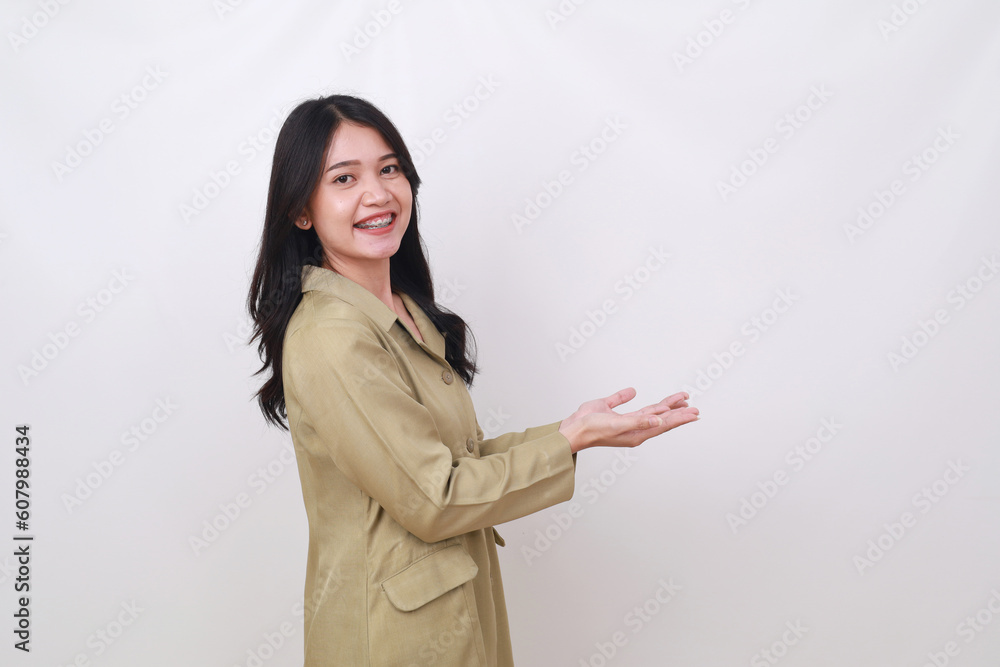 Happy young indonesian civil servant holding something Happy young indonesian civil servant holding something