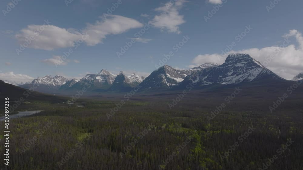 The majestic Canadian Rockies rise out of the pine filled valley in Jasper The majestic Canadian Rockies rise out of the pine filled valley in Jasper