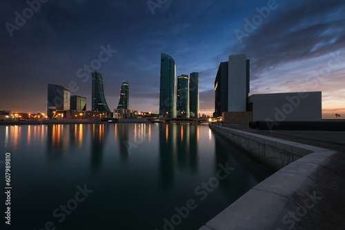 Beautiful sky with amazing colors and Bahrain skyline with reflection after dusk - Long Exposure