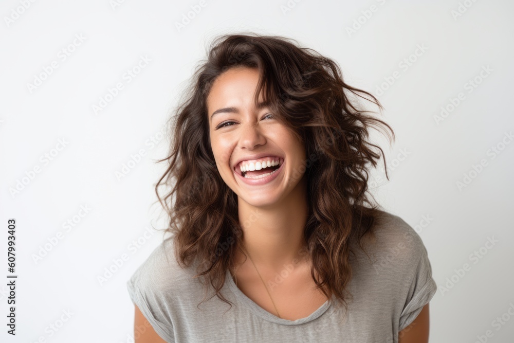 Portrait of a happy young woman laughing isolated on a white background Portrait of a happy young woman laughing isolated on a white background