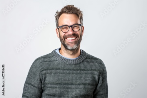 Portrait of a handsome young man wearing glasses and smiling at the camera. © Robert MEYNER