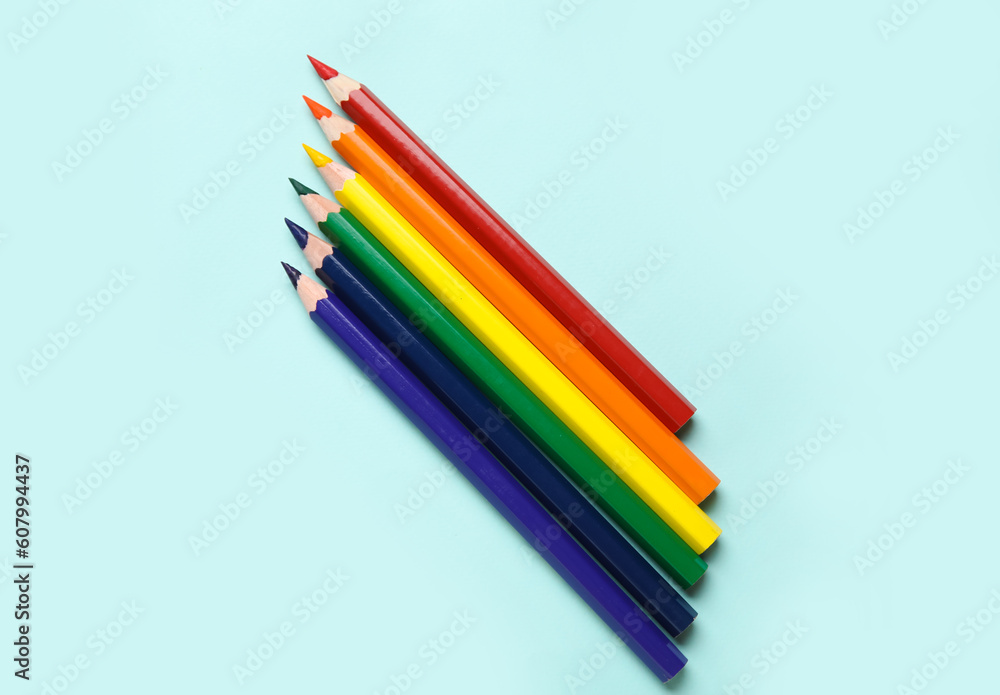 Colorful pencils on blue background. LGBT concept Colorful pencils on blue background. LGBT concept