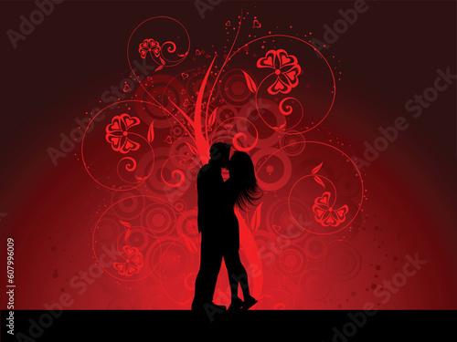 Silhouette of a kissing couple on a decorative background