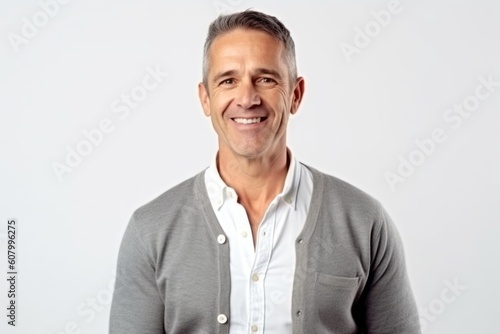 Portrait of happy mature man smiling at camera isolated over white background
