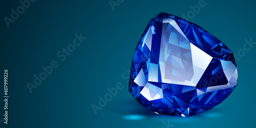 A big precious blue crystal like a sapphire with highlights and shadow on a color background. Faceted gemstone