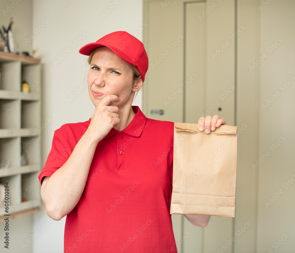 with mouth and eyes wide open and hand on chin. delivery and take away concept with mouth and eyes wide open and hand on chin. delivery and take away concept